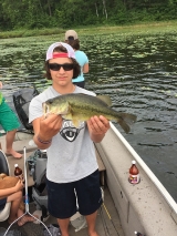 <h5>Round Lake</h5><p>Susan took her family fishing and they loved it! Here's Garrett's big catch!</p>