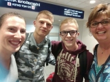 <h5>Suzanne at the airport with French exchange student</h5>